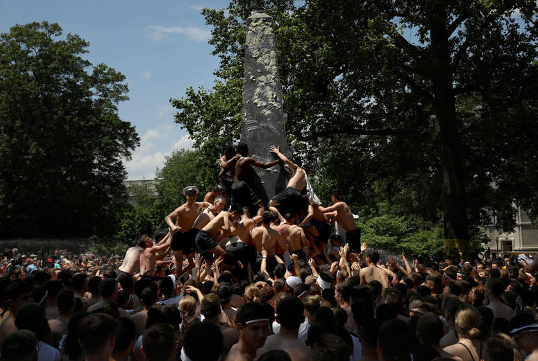 The U.S. Naval Academy Class of 2022 climbs the Herndon Monument. The U.S. Naval Academy Class of 2022 climbs the Herndon Monument.