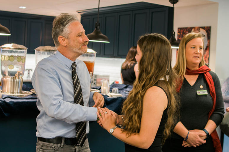 Stewart greets a family member and TAPS' Dr. Shauna Springer in background