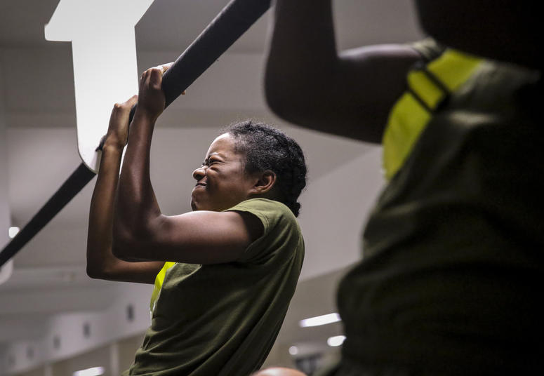U.S. Marine Corps recruits with Platoon 4038, Papa Company, 4th Recruit Training Battalion, execute pull-ups during their Initial Strength Test on Parris Island July 20, 2018. The minimum physical requirements for female recruits to begin training are 44