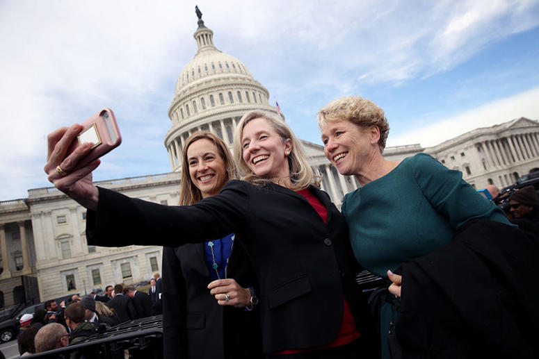 WASHINGTON, DC - NOVEMBER 14: Newly elected members of the House of Representatives Abigail Spanberger (C) (D-VA), Mikie Sherrill (L) (D-NJ) and Chrissy Houlahan (D-PA) take a selfie in front of the U.S. Capitol following an official class picture of new House Representatives-Elect Pose For Group Photo In Front Of U.S. Capitol