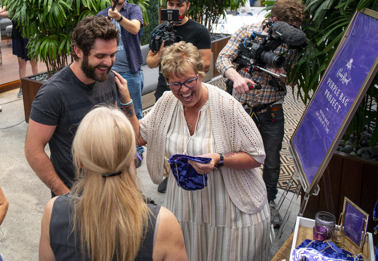 Crown Royal joined forces with The Purple Bag Project partners Thomas Rhett and Packages From Home, a 501(c)(3), to reunite Mothers Of Military with their active duty sons and daughters Crown Royal The Purple Bag Project partners Thomas Rhett and Packages From Home, Mothers Of Military