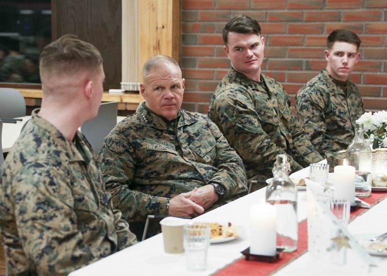 Commandant of the Marine Corps Gen. Robert B. Neller eats with Marines in Vaernes, Norway, Dec. 20, 2018.