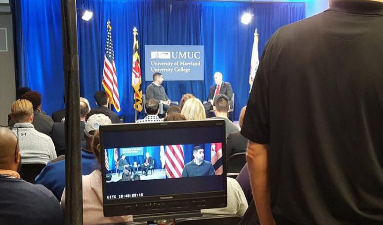 Medal of Honor recipient Florent "Flo" Groberg speaks at a UMUC event emceed by UMUC's Keith Hauk.