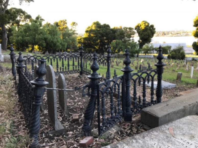 A bent and twisted Victorian-era fence on the Mare Island Naval Cemetery.