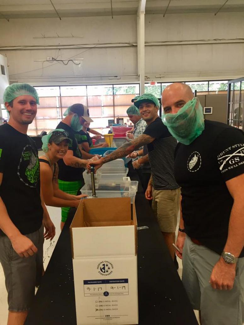 Grunt Style team members pack supplies as part of the company's hurricane Harvey recovery efforts in Texas.
