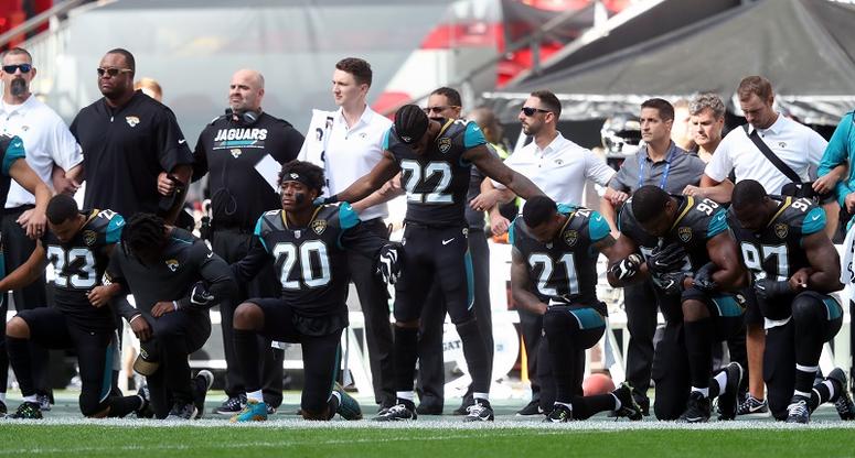 Jacksonville Jaguars players kneeling in protest during the national anthem before the NFL International Series match at Wembley Stadium, London.
