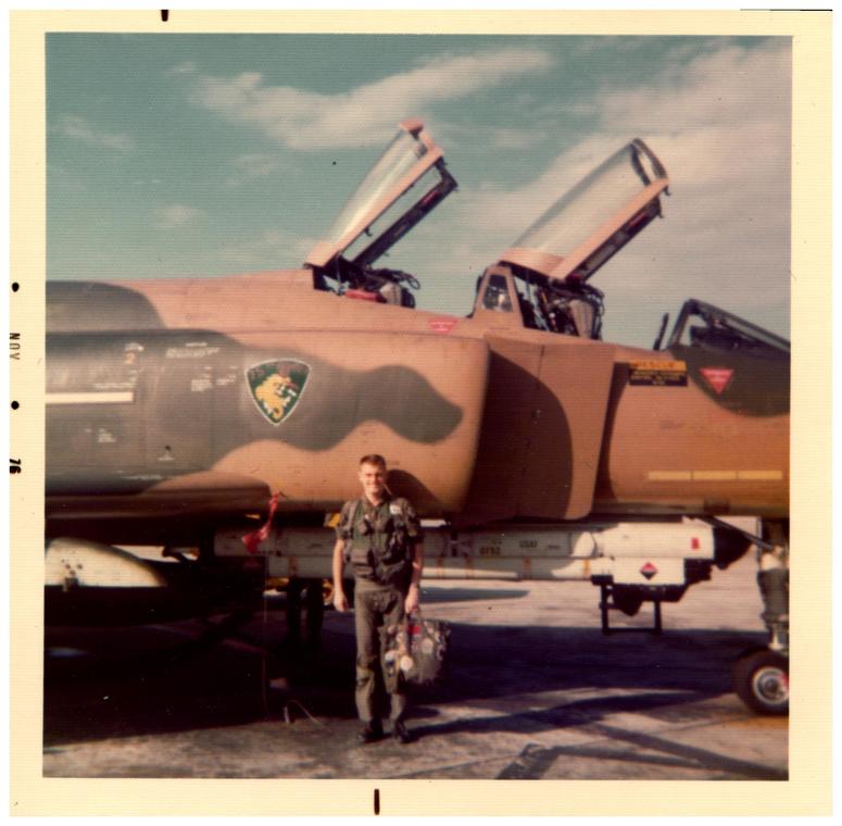 Larry Nazimek poses in front of a F-4D Phantom at Kadena Air Base in Japan.