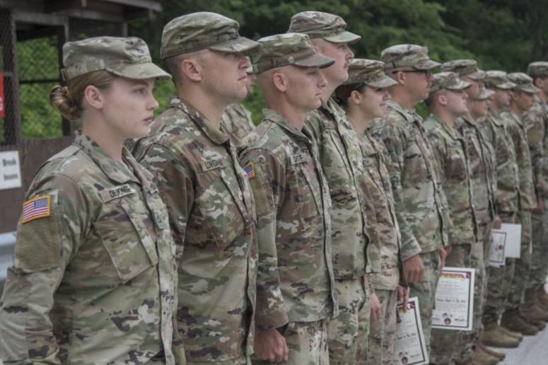 Nebraska National Guard Soldiers with the 1-134th Cavalry Squadron receive certificates and silver spurs after successful completion of a spur ride during annual training in the Republic of Korea. Nebraska National Guard Soldiers with the 1-134th Cavalry Squadron receive certificates and silver spurs after successful completion of a spur ride during annual training in the Republic of Korea.