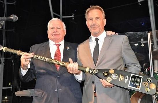 Kevin Costner (right) with a Navy Paddle created by Kyle Nyseth
