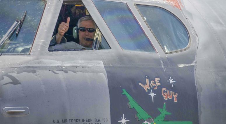 U.S. Air Force Col. Robert Burgess, 307th Operations Group commander, gives a thumbs up after flying a B-52 Stratofortress, nicknamed "Wise Guy," to Barksdale Air Force Base, Louisiana Wise Guy back in the sky