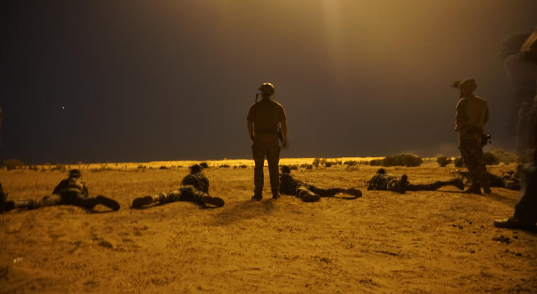 U.S. Army Special Forces soldiers observe as Nigerien armed forces service members fire their weapons with the assistance of Illumination rounds during Exercise Flintlock 2017 in Diffa, Niger, March 9, 2017.