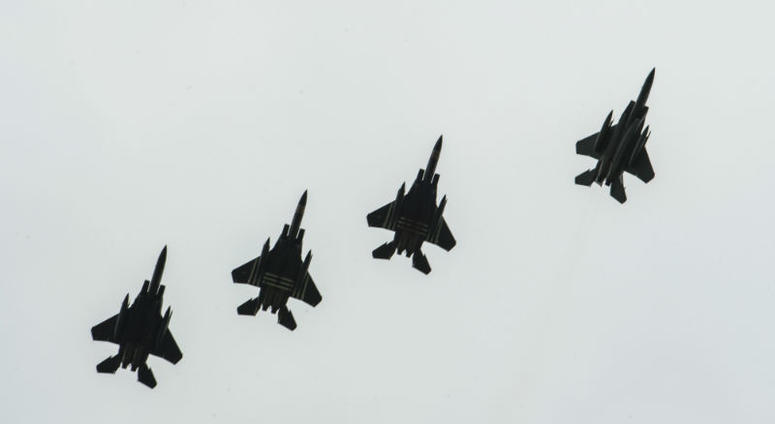 Four F-15E Strikes Eagles, assigned to the 48th Fighter Squadron, Royal Air Force Lakenheath, England,conduct a fighter escort for 23 aircraft dropping personnel. Over 1,000 U.S. paratroopers participate in largest airborne operation since WWII to commemorate 75th anniversary of D-Day.