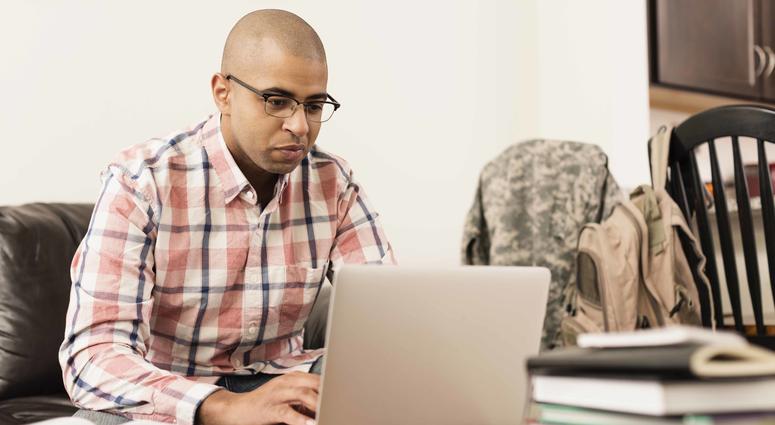 Adult student working on a computer