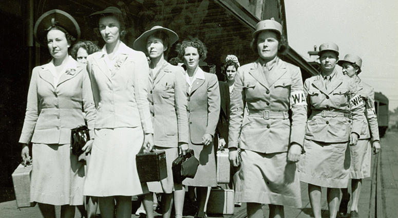 Newly arrived Women's Army Auxiliary Corps recruits march at Fort Des Moines, Iowa, in 1942. Newly arrived Women's Army Auxiliary Corps recruits march at Fort Des Moines, Iowa, in 1942.