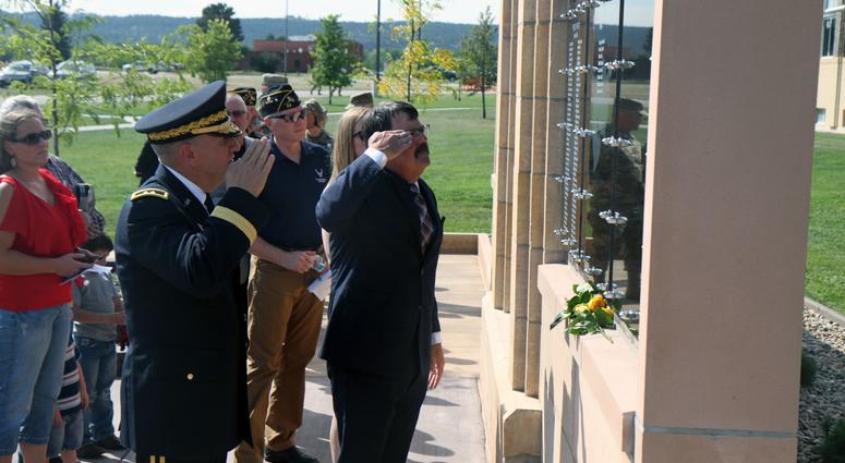 South Dakota Lt. Gov. Matt Michels and Maj. Gen. Tim Reisch, adjutant general of the South Dakota National Guard, salute in honor of 171 fallen SDNG soldiers