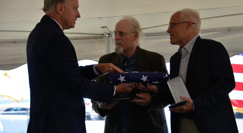 Massachusetts U.S. Representative Bill Keating presented Stephen and Bradley Finch with an American flag