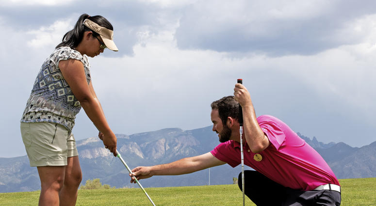 Twin Warriors Golf Club pro Allan McDermott provides swing technique advice to U.S. Marine Corps Veteran Phoebe Comeau during a golf outing at the Twin Warriors Golf Club, Bernalillo, New Mexico. Twin Warriors Golf Club pro Allan McDermott provides swing technique advice to U.S. Marine Corps Veteran Phoebe Comeau during a golf outing at the Twin Warriors Golf Club, Bernalillo, New Mexico.