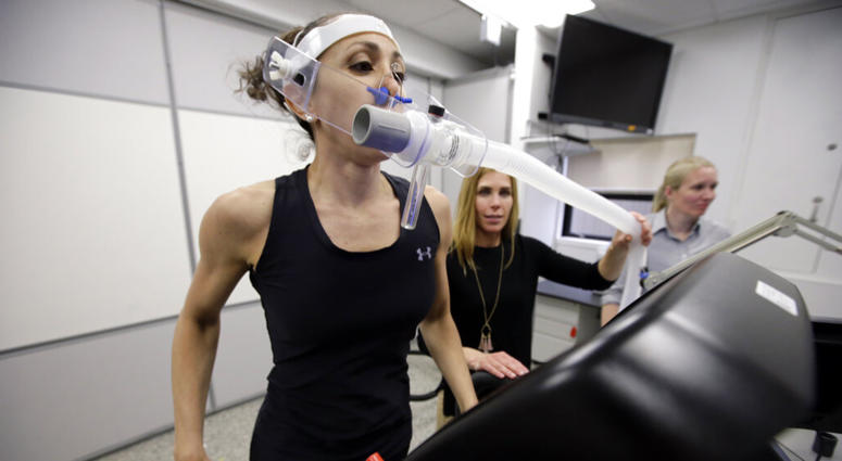 Research scientist Leila Walker, left, is assisted by nutritional physiologist Holly McClung, center, as they demonstrate equipment designed to evaluate fitness levels in female soldiers, who have joined elite fighting units such the Navy Seals. Research scientist Leila Walker, left, is assisted by nutritional physiologist Holly McClung, center, as they demonstrate equipment designed to evaluate fitness levels in female soldiers, who have joined elite fighting units such the Navy Seals.
