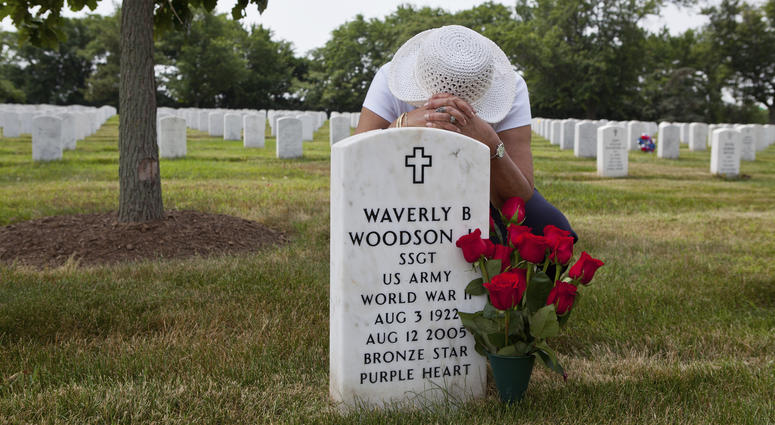Joann Woodson at the grave site of Cpl. Waverly B. Woodson Jr. at Arlington National Cemetery in Arlington, Va. Joann Woodson at the grave site of Cpl. Waverly B. Woodson Jr. at Arlington National Cemetery in Arlington, Va.