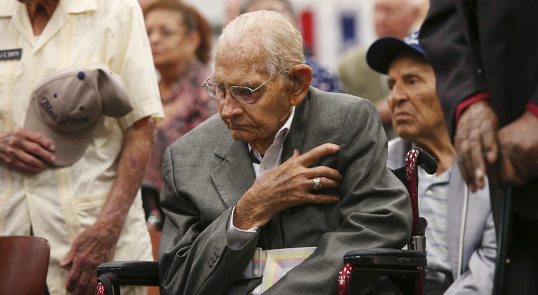 Cyrus Hayford Avey, Jr, 100, U.S. Air Force World War II veteran honors the flag during a ceremony at Joint Base San Antonio-Fort Sam Houston