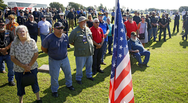 Mourners attend a funeral service for World War II veteran Herman White