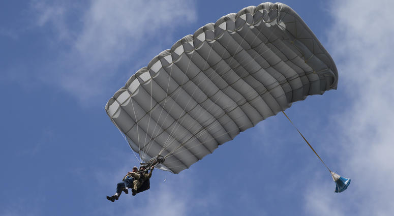 Tom Rice, a 98-year-old American WWII veteran, front left, approaches the landing zone during a tandem parachute jump near Groesbeek, Netherlands, Thursday, Sept. 19, 2019, as part of commemorations marking the 75th anniversary of Operation Market Garden. 98 year old WWII vet jumps from a plane in Europe.