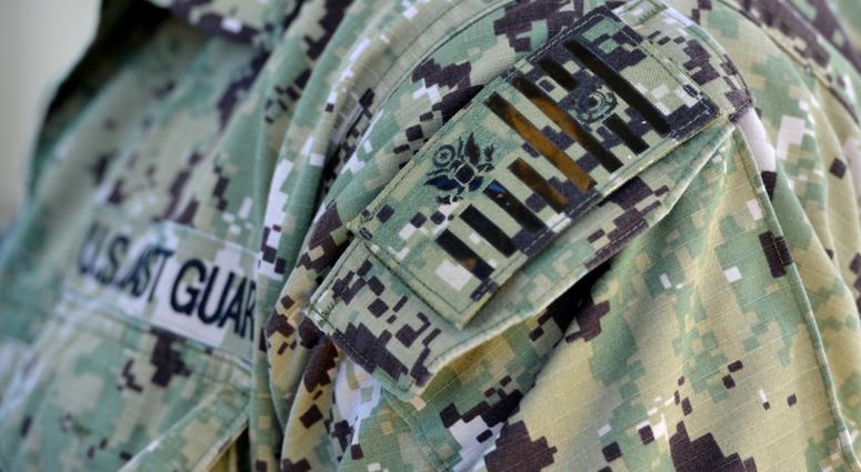 A Coast Guard Port Security Unit 311 service member donning a type III uniform attends an all-hands meeting with Vice Adm. Linda Fagan, commander Pacific Area, at Naval Station Guantanamo Bay, Cuba, Dec. 14, 2018.
