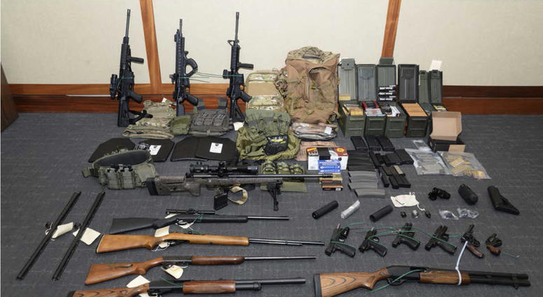 This undated file image provided by the U.S. District Court in Maryland shows a photo of firearms and ammunition that was in the motion for detention pending trial in the case against Christopher Hasson. A federal magistrate agreed on Thursday, April 25,