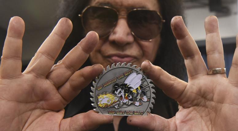 Gene Simmons of KISS shows a custom-made coin presented to him during a meet-and-greet at the Pentagon, Washington, D.C., May 16, 2019. GeneSimmonsPentagon3