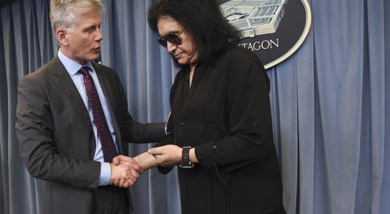 Assistant to the Secretary of Defense for Public Affairs Charles E. Summers Jr. talks with Gene Simmons of KISS during a meet-and-greet at the Pentagon, Washington, D.C., May 16, 2019. GeneSimmonsPentagon8