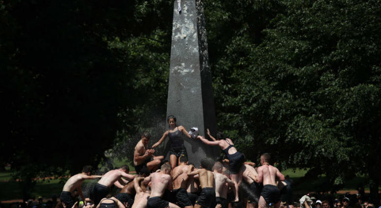 The U.S. Naval Academy Class of 2022 climbs the Herndon Monument. Plebes no more: U.S. Naval Academy Class of 2022 climbs the Herndon Monument.