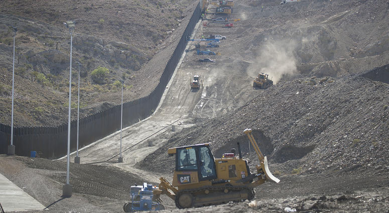 Construction crews work on a border wall being put in place by We Build The Wall Inc. in Sunland Park, New Mexico. Construction crews work on a border wall being put in place by We Build The Wall Inc. in Sunland Park, New Mexico.