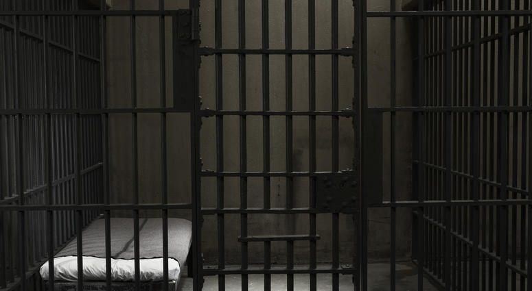stock photo prison cell inside of a stark prison cell