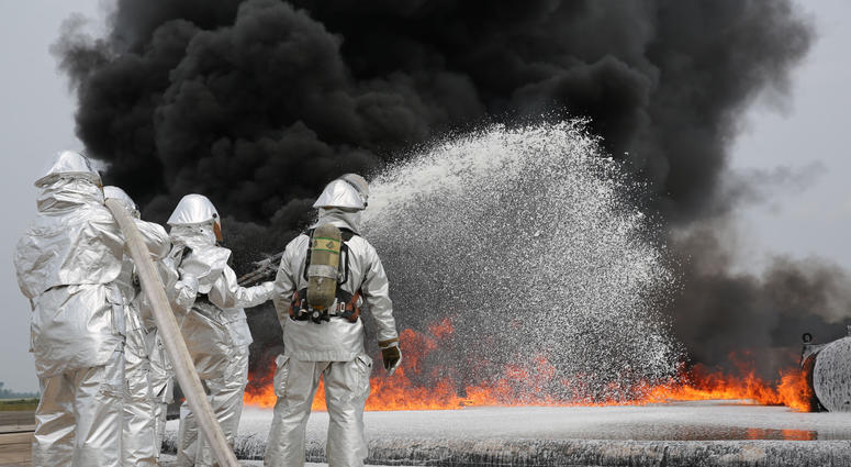 Marines with Bulk Fuel Company, 8th Engineer Support Battalion, 2nd Marine Logistics Group use Twin Agent Units to extinguish a blaze during a live fire training exercise aboard Marine Corps Air Station Cherry Point, Aug. 28, 2013. TAUs combine dry chemic Marines with Bulk Fuel Company, 8th Engineer Support Battalion, 2nd Marine Logistics Group use Twin Agent Units to extinguish a blaze during a live fire training exercise aboard Marine Corps Air Station Cherry Point, Aug. 28, 2013. TAUs combine dry chemic