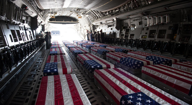 Transfer cases, containing the remains of what are believed to be U.S. service members lost in the Korean War, line a U.S. Air Force C-17 Globemaster III aircraft during an honorable carry ceremony at Joint Base Pearl Harbor-Hickam (JBPH-H), Hawaii, Aug.