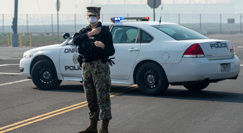 NAVAL BASE VENTURA COUNTY, Calif. (Nov. 10, 2018) Master-at-Arms 2nd Class Courtney Altman, a native of Hendersonville, N.C., assigned to Naval Base Ventura County-Point Mugu, communicates with base personnel during the evacuation process. Navy personnel