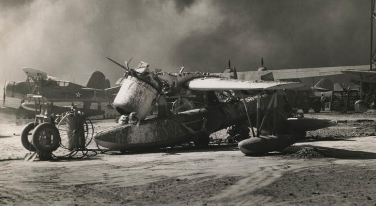 "Wrecked Seaplane - One of the 30 U.S. Navy planes wrecked by Japanese bombs and bullets during the air attack on Pearl Harbor. The plane was on OS2U, an Observation Scout built by Vought-Sikorsky" (Official Navy Photograph)
