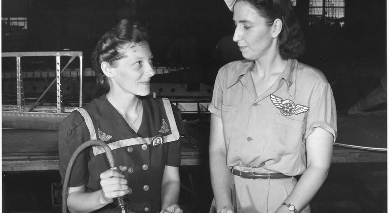 Pearl Harbor widows have gone into war to carry on the fight with a personal vengeance. Mrs. Virginia Young (right), whose husband was one of the first casualties of World War II, is a supervisor in the Assembly and Repairs Department of the Naval Air Bas