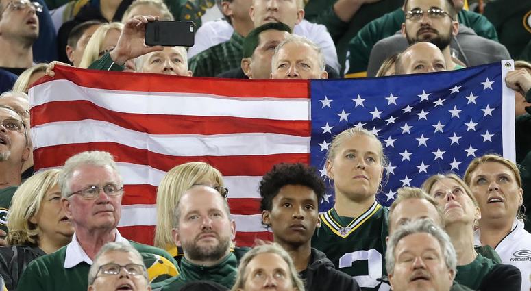 Green Bay Packers fans stand for the national anthem prior to the Packers' game against the Chicago Bears at Lambeau Field, Sep 28, 2017.