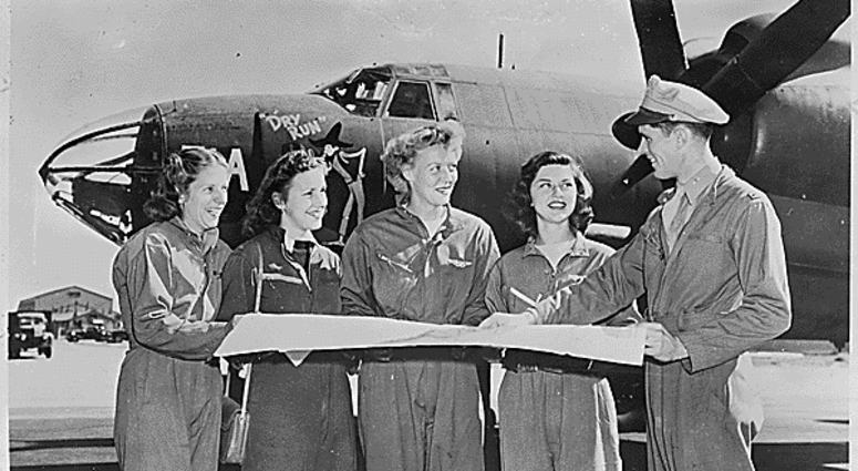 Four members of the United States Women's Airforce Service Pilots (WASPs) receive final instructions as they chart a cross-country course on the flight line of U.S. airport. Four members of the United States Women's Airforce Service Pilots