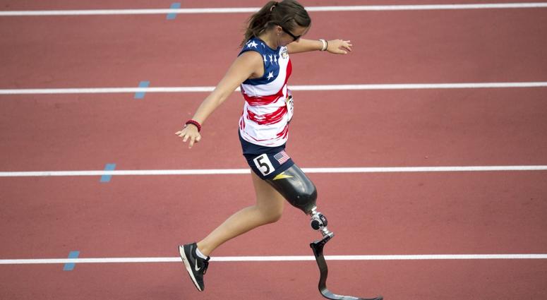 Air Force Captain Christy Wise checks the fitting of her prosthetic leg while running a sprint during the 2017 Invictus Games in Toronto, Canada Sept. 24, 2017. WomanVeteranProsthetic