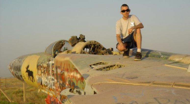 Andrew Koehle on top of a derelict Russian MiG at Balad Air Base, Iraq Blad Air Base Andrew Koehle sits atop a derelict Russian MiG fighter