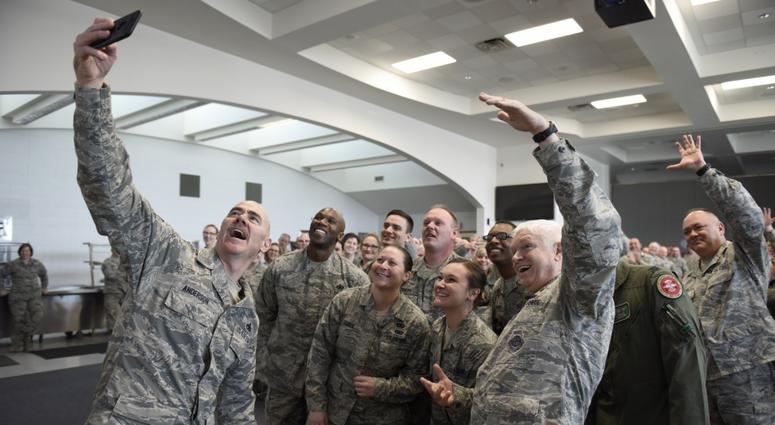 U.S. Air Force Lieutenant General L. Scott Rice, director of the Air National Guard, and U.S. Air Chief Master Sgt Ronald C. Anderson, command chief master sergeant for the ANG, take a selfie with the Airmen of the 180th Fighter Wing, Ohio National Guard