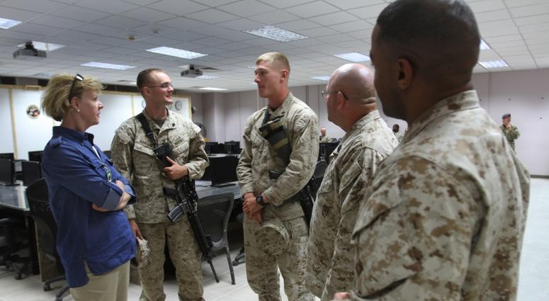 U.S. Sen. Tammy Baldwin of Wisconsin talks with Marines from Wisconsin about their hometowns at the NATO conference room on Camp Leatherneck, Afghanistan, May 4, 2013.