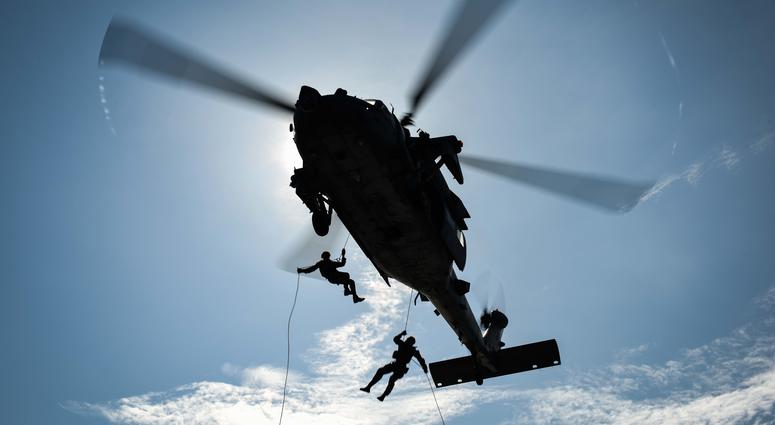 Sailors rappel from an MH-60S Sea Hawk to the flight deck of the aircraft carrier USS Theodore Roosevelt (CVN 71) on March 27, 2018.
