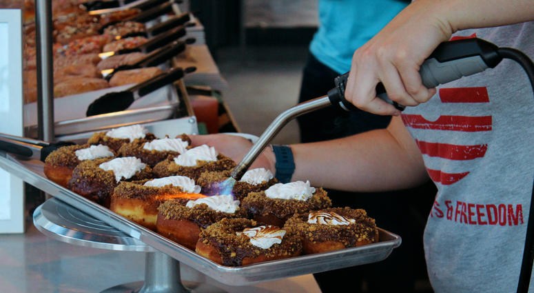 Smores doughnuts bruleed upon order Specialty doughnuts bruleed upon order for customers.