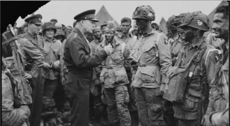 General Dwight D. Eisenhower gives the order of the Day. Full victory-nothing else to paratroopers in England, just before they board their airplanes to participate in the first assault in the invasion of the continent of Europe, June 5, 1944.