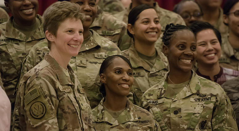 U.S. Air Force Brig. Gen. Leah Lauderback, Col. Carmelia Scott-Skillern and Lt. Col. Donna Sims pose for a photo with other attendees during a Sisters in Arms forum Oct. 25, 2017, at the Zone 1 Chapel.