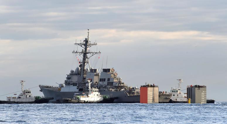 TOKYO BAY, Japan - The Arleigh Burke-class guided-missile destroyer USS Fitzgerald (DDG 62) is loaded onto the heavy lift transport MV Transshelf