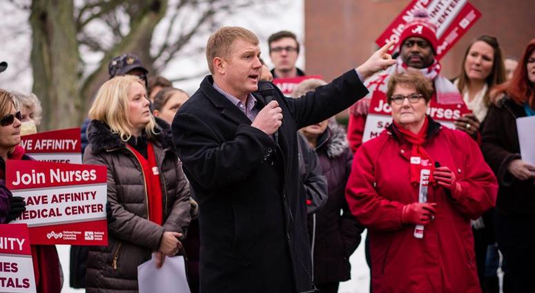 Navy vet Ken Harbaugh speaks at a campaign event in Ohio's 7th District.